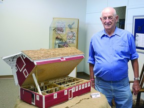 Alfred Neuman, standing next to his model of the Neuman family farm barn, has his models on display at the Strathcona County Museum and Archives until Sept. 30. In addition to the family property, he has also created models of historical buildings in Strathcona County. Steven Wagers/Sherwood Park News/QMI Agency