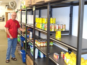 Joseph O’Neill, a volunteer with the Elliot Lake Emergency Food Bank, stands next to some of the organization’s shelves that are low on some items.
Photo by KEVIN McSHEFFREY/THE STANDARD/QMI AGENCY