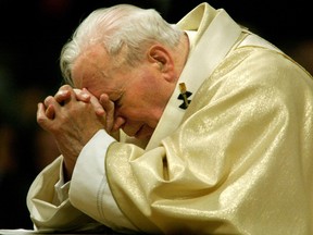 Pope John Paull II leads Holy Thursday prayers in Rome in 2002.