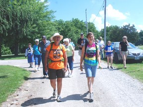 Sandi Pyper, left and her daughter, Meagen, walk into the Pearce Williams Christian Centre property Friday after completing a 22-day walk to raise awareness for the centre. Sandi walked most of the way and had to stop with less than a week remaining due to health problems. Her daughter finished the walk.