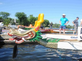 Onlookers watch as a dragon boat is launched into Ramsey Lake. The Sudbury Dragon Boat Festival goes this Saturday at Bell Park. GINO DONATO/THE SUDBURY STAR