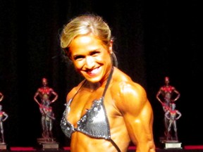 Sarnia's Larissa Scimmi poses during the Henderson Thorne Classic fitness competition. Scimmi won the women's physique and women's bodybuilding divisions in her first ever competition. SUBMITTED PHOTO/THE OBSERVER/ QMI A GENCY