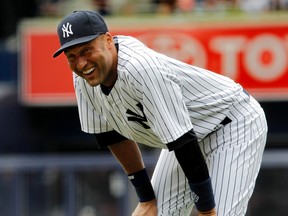 Derek Jeter smiles as he limbers up prior to Thursday’s return to the Yankees lineup. The comeback was short-lived as the Yanks captain suffered a strained quad and will be out until after the all-star break.