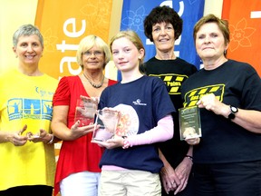 From left; Linda Ydreos, Gladys Martin, Abbey Bachard, Paula Brady, and Bonnie Van Bavel, were all given plaques for their fundraising efforts at the Canadian Cancer Society's Chatham location on Wednesday July 10, 2013. The Cancer Society awarded the top fundraising groups and individuals for their contributions during the annual Relay for Life in Chatham on June 14-15. (KIRK DICKINSON, For the Daily News)