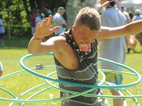 Nathan Poeppner of Azilda shows his skill with multiple hula hoops at the mini olympics at Camp Qaulity in Monteville.