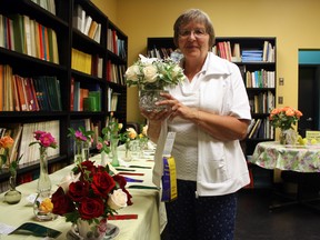 The Timmins Horticultural Society’s rose show bloomed on Thursday at the Timmins Museum: National Exhibition Centre. The Horticultural Society’s Gail DeFelice takes a whiff of one of the aromatic entries, which were judged by local flower expert Denise Young. Lisa Ahern won Best Rose, while junior member Abby Ollila was recognized for her lovely floral arrangement.
