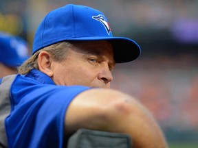 Blue Jays manager John Gibbons watches his team — minus Brett Lawrie, who is still with triple-A Buffalo — battle the Baltimore Orioles last night at Camden Yards. (DOUG KAPUSTIN/Reuters)