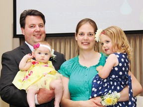 Rev. Andrew Bellous was joined by his wife Monica and their daughters Rosalie, seven months, and Susannah, 3, following his ordination at First Baptist Church Pembroke on June 23.