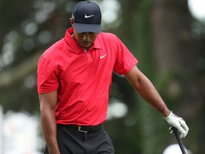 Tiger Woods reacts to hitting his tee shot out of bounds during the final round of the 2013 U.S. Open golf championship at the Merion Golf Club in Ardmore, Pennsylvania, June 16, 2013. (Adam Hunger, Reuters)