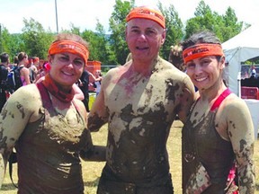 The Sault's Carol Lucio (left) poses with teammates Don Nadeau (centre) and Elena Palazzi after a Tough Mudder event earlier this year.