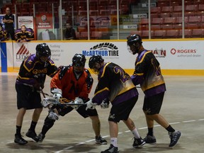 The Owen Sound Quantum Properties NorthStars' Mike MacLeod battles with three Norwood defenders on Saturday in the N'Stars 11-3 loss to the James Gang in Ontario Lacrosse Association Senior B League playoff action.