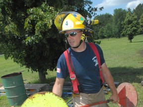 Teeterville firefighter Harold Wood took part in the Norfolk County fire department’s annual “competition day” at Wind-Del Park in Windham Centre on Saturday. Firefighters from across the county competed in a series of events. (DANIEL R. PEARCE Simcoe Reformer)
