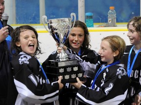 Novice team members Jordan Sloan, Abby Gerlinsky, Bailee Bancranz and Kate Jingles enjoy a moment together after winning first place at the provincial championships. (Submitted/Cristan Anderson)