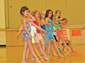 The girls show of their dance routines for Inglenook Studio's Dance and Art Camp wrap-up at Pope John Paul ll School on Friday afternoon.
MARNEY BLUNT/DAILY MINER AND NEWS