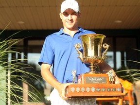 Richmond Hill's Christian McCullough, a member of Stouffville's Meadowbrook Golf and Country Club, poses with the championship trophy after winning the 61st running of the Bill Morland Invitational. His dad Mark McCullough won the tournament in 1990s.