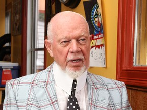 Legendary hockey commentator Don Cherry talks to a reporter during an interview inside Ernie's Wolfe Island Pub and Pizzeria on Friday. (Ian MacAlpine The Whig-Standard)