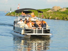 An estimated 2,000 boats and 10,000 people attended the annual Pottahawk Bash, a giant party on the water south of Turkey Point on Sunday. Police say the event has calmed down over the years. (DANIEL R. PEARCE Simcoe Reformer)