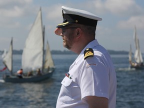 Commanding Officer Rodney Turcotte inspects and salutes cadets during the HMCS Ontario whaler naming ceremony at RMC Sunday. (Danielle VandenBrink The Whig-Standard)