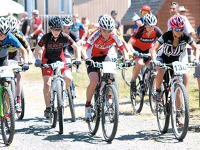 Mountain bikers begin their race at the Canada Cup at Naughton Trails on Sunday.