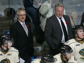 Dave Warren, left, has been hired as the new head coach of the Lambton Shores Predators. The former London Knights area scout and skills coach is pictured on the Knights' team bench in Nov., 2009. (Submitted photo)