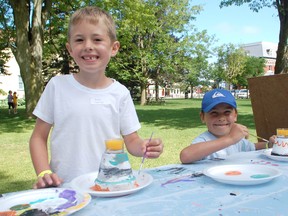 The 21st annual Kids in the Park camp, hosted by the Harbour Community church entertained children in Victoria Park. L-R: Dylan Garneau and Koby Palmer work hard on their crafts on July 11, 2013. (ALANNA RICE/KINCARDINE NEWS)