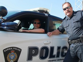 Det.-Const. Mike Callander is spending the last weeks of his 36-year-long career on patrol with his son Tyler. The 57-year-old is retiring July 30. (TYLER KULA, The Observer