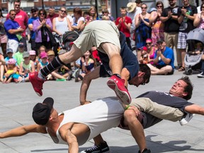 Members of the Flying Tortillas, who came from California to preform for their first time at the Buskers Rendezvous show off impressive acrobatic and break-dancing moves. 
Sam Koebrich for The Whig-Standard