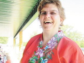 Sheryl King, Mayerthorpe and Areas Aquatic and Recreation Society president, sell 50-50 tickets Canada Day events at the Fallen Four Memorial, a fundraiser for enhancements for the new swimming pool.