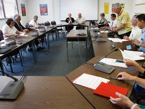 Members of the Hastings and Prince Edward District School Board discuss a motion to award a $554,500 contract to 'T.A.S. Communications' for the supply, installation, testing and commissioning of 28 front-entry-door-school video surveillance systems during a special and brief meeting at the board's office in Belleville Monday morning.
