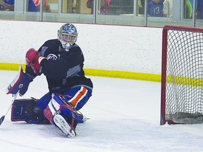 Troy Trombley flashes the left pad to make a stellar kick save during Oilers development camp on Saturday, July 6 at Millennium Place. Steven Wagers/Sherwood Park News/QMI Agency