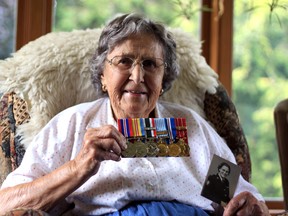 Frances Walton, 92, holds her medals and an old photo from when she was a nurse in the Canadian Armed Forces Medical Core. Walton will be featured on a new website called The Hereos of Zorra, which profiles and pays tribute to veterans and members of the Canadian Armed Forces from Zorra Township.  (CODI WILSON/Sentinel-Review)
