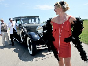 Shaelah Pirie, far right, gives James Lizotte, far left, and Thomas Smith, the brush off as  they try to charm her during the launch of the United Way of Chatham-Kent's Runways Gala launch. The 1920s Great Gatsby themed fundraising evening will include antique cars, auction, entertainment and a dinner. PHOTO TAKEN Charing Cross, ON., Monday July 15, 2013. Diana Martin/Chatham Daily News/QMI Agency
