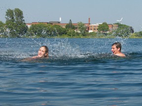 Sarah Lyn Demontigny and Dogan Benoit frolic in the cool waters of the St. Lawrence River near Cornwall Harbour to beat the heat on Monday.
Greg Peerenboom staff photo