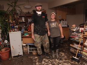 KEVIN RUSHWORTH HIGH RIVER TIMES/QMI AGENCY. Lori and Colin Marshall were relieved to be able to return home to help assess the damage in Wallaceville, but what they found was horrifying, yet easier to deal with than the waiting.