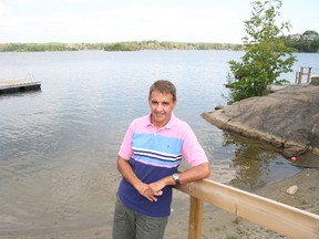 Dr. Robert Masih, of Sudbury, relaxes by the water at his home in Sudbury, ON. on Monday, July 15, 2013. JOHN LAPPA/THE SUDBURY STAR/QMI AGENCY