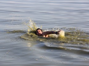 Cornelius Unger, 18, of Blenheim described the water at the Erieau public beach as "gross" when he showed up for a swim Monday evening. He decided to enter for a dip because the air temperature was so hot, but planned to shower when he got home.