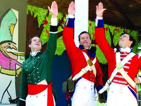 Melvin Macdonell, left, played by Warren Bain, Lt. Frederic de Gaugreben (David Snelgrove) and Lt. Harold Brown (Kelly Penner) swear an oath to greatness in this scene from 'Maid for a Musket.' Saturday's opening night of 'Maid" contributed to a record-breaking opening weekend for the St. Lawrence Shakespeare Festival in Prescott. (SUBMITTED PHOTO)