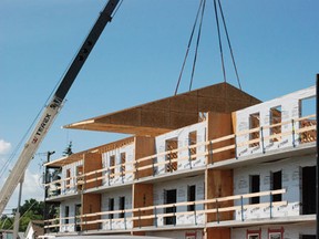 The roof went up on the new apartment buildings behind the Legion Place in Melfort on Thursday, July 4.