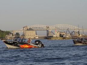 Boaters line up on the St. Marys River Sunday for the 7 a.m. start of the second day of the Kiwanis International Walleye Tournament in front of the International Bridge. The annual event drew 42 boats from Canada and the U.S. Local brothers John and Rob Eusebi took first place this year, winning $5,000.