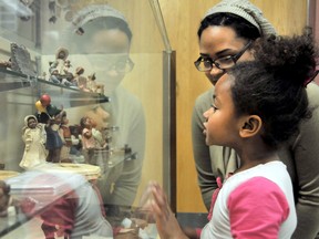 Olivia Vandenbaerde, 5, looks over a number of black themed figurines at the Chatham-Kent Black Mecca Museum. (QMI Agency file photo)