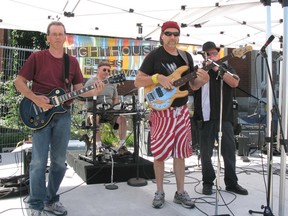 Kevin Vokes on guitar, David Glass on bass, Steve Ballard on drums, and Tim Eaton on harmonica make up Bluestones, playing in front of the library during the Kincardine Street Festival. (JULIA HERRICK/KINCARDINE NEWS FREELANCE)