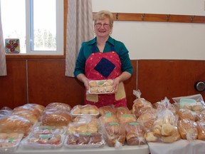 Judy Jeffrey displays home-baked goods donated for the Cloudslee United Church.