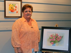 Huguette Perron's artwork and painted glassware are both on display and for sale at the Summer Fun Arts and Crafts Exhibition at the library right now.