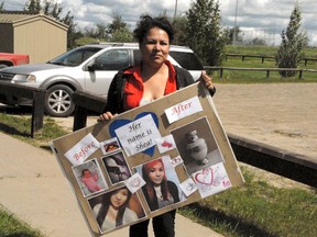 Mona Horseman holds up a poster of her daughter, Shea Ty Dionne Horseman, outside the Wellness Centre in Horse Lake on Thursday, July 11, 2013. Mona and fellow community members marched their way through the streets of the First Nation reserve (west of Hythe) in an effort to raise drug awareness Thursday afternoon. Mona lost her 16-year-old daughter to drugs this past May. CARYN CEOLIN/DAILY HERALD-TRIBUNE/QMI AGENCY