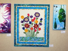 A quilt by Joyce Jones is just one of the many beautiful pieces of art that are adorning the walls of the Fairview Fine Arts Centre this month as part of the centre's semi-annual members' show. MICHAELA HIEBERT/FAIRVIEW POST/QMI AGENCY