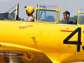 Peter Van Schie, 15, pictured at rear, went back more than 70 years when private pilot Edward P. Soye revved up the engine of his Second World War 'Harvard IV' and took off Tuesday afternoon. Van Schie is enrolled in Royal Canadian Air Cadets' advance aviation course at Trenton Air Cadet Summer Training Centre at 8 Wing/CFB Trenton (TACSTC).