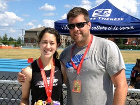 Sarnia's Danielle Quinn, and Sarnia Athletics Southwest coach Joel Skinner get together for pictures after Quinn won gold in the women's long jump at the Canadian junior national championships in Sainte-Therese, Que. Sunday, July 14, 2013. (Submitted photo)