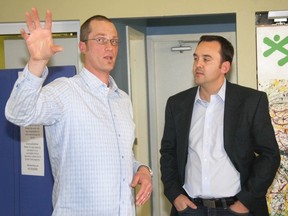 NOEL EDEY cochrane times
Dylan Oosterveld, left, explains to Wild Rose MP Blake Richards the changes being made to the Boys and Girls Club of Cochrane and Area with the $25,000 federal grant secured by the club in February. Oostervald has left to tackle a new challenge in Calgary, also with the Boys and Girls Club.