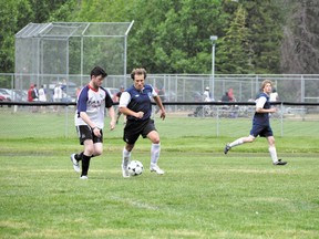 Canmore United's Ivan Babikov chases after the ball during the team's game against the Pump & Tap Tavern on Sunday, July 14, 2013. Canmore United won 2-1. CORRIE DIMANNO/ CRAG & CANYON/ QMI AGENCY