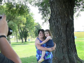 Yvonne Morassut and her daughter Suzie, 1 1/2, had their photo taken Wednesday at Lee Park during Portraits in the Park, a fundraiser for the family of a North Bay man battling brain cancer.
